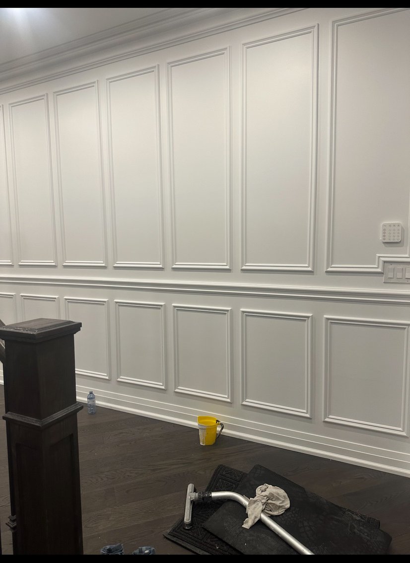 Kitchen pantry with white cabinets and dark countertops