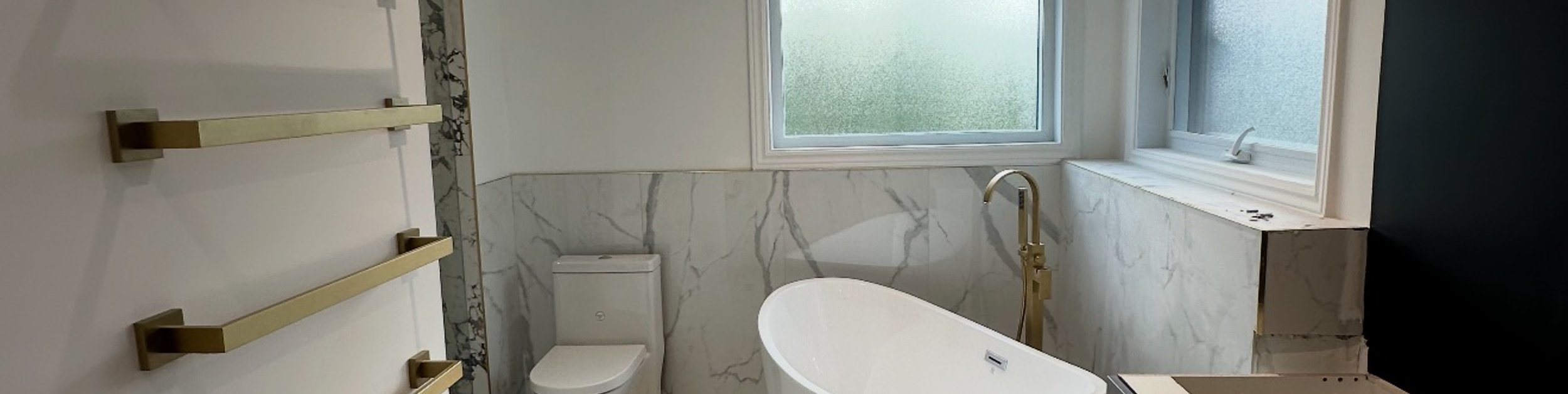 Open-concept kitchen with large central island view from living area