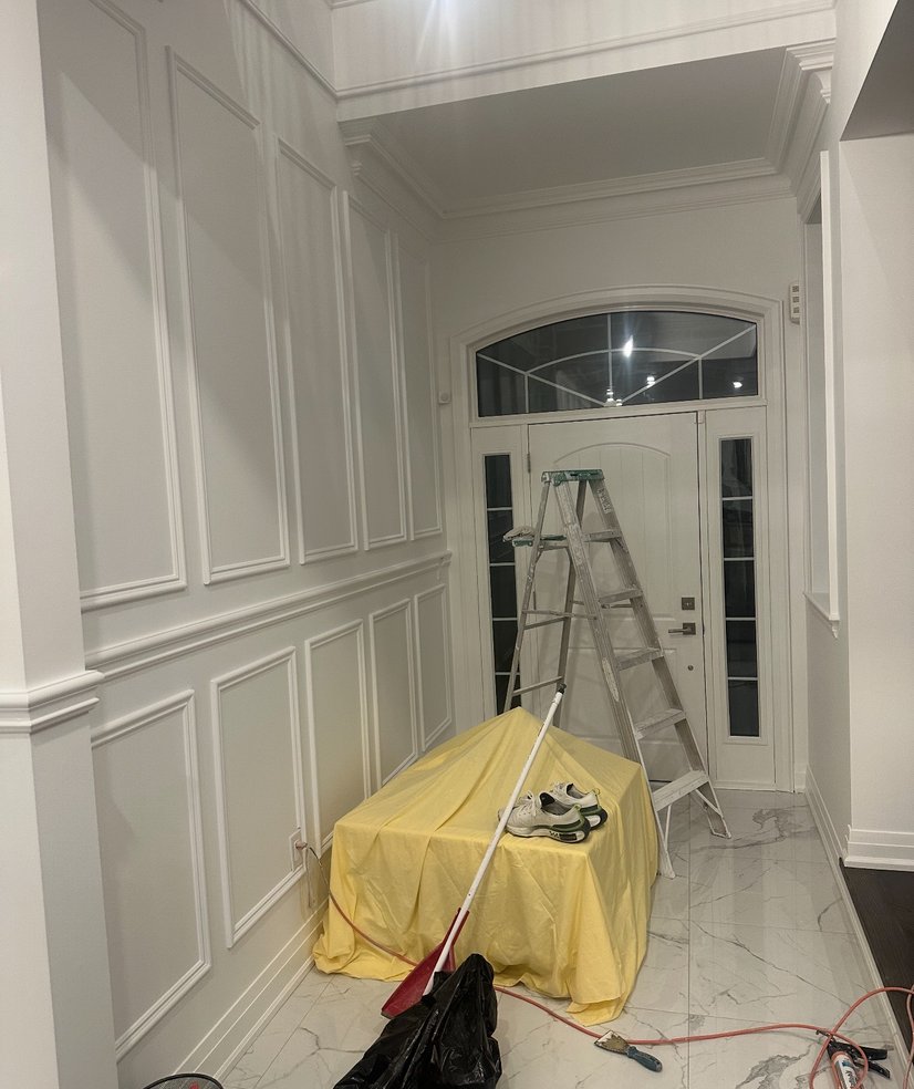 Bathroom with glass-enclosed shower and light tiles