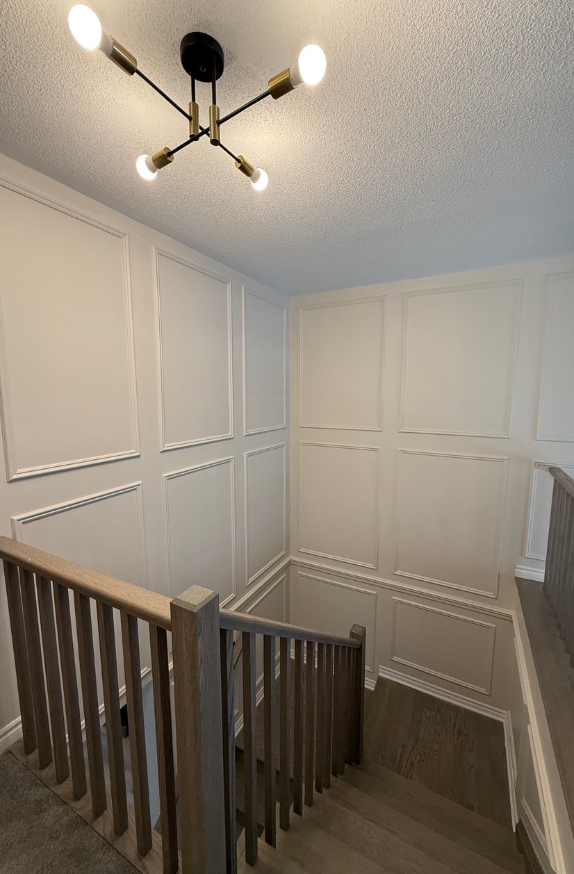 Staircase with dark wood treads and white risers